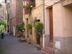 The narrow streets in the Old Town at Montauroux, Provence, resplendent with hanging baskets and trailing plants. In the summer the tables of Le Marina restaurant, overflow into the adjacent side streets.